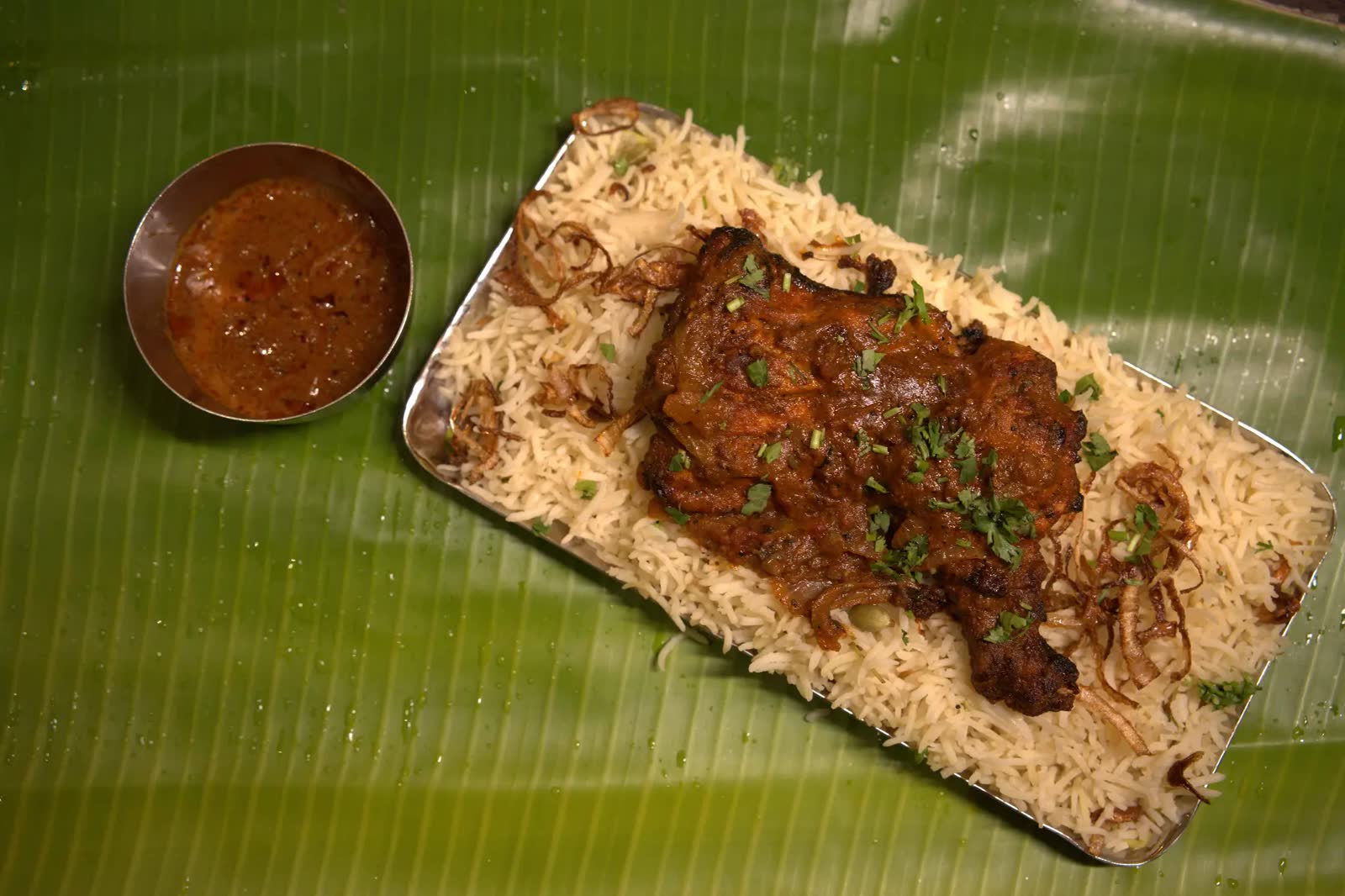Biryani platter on banana leaf